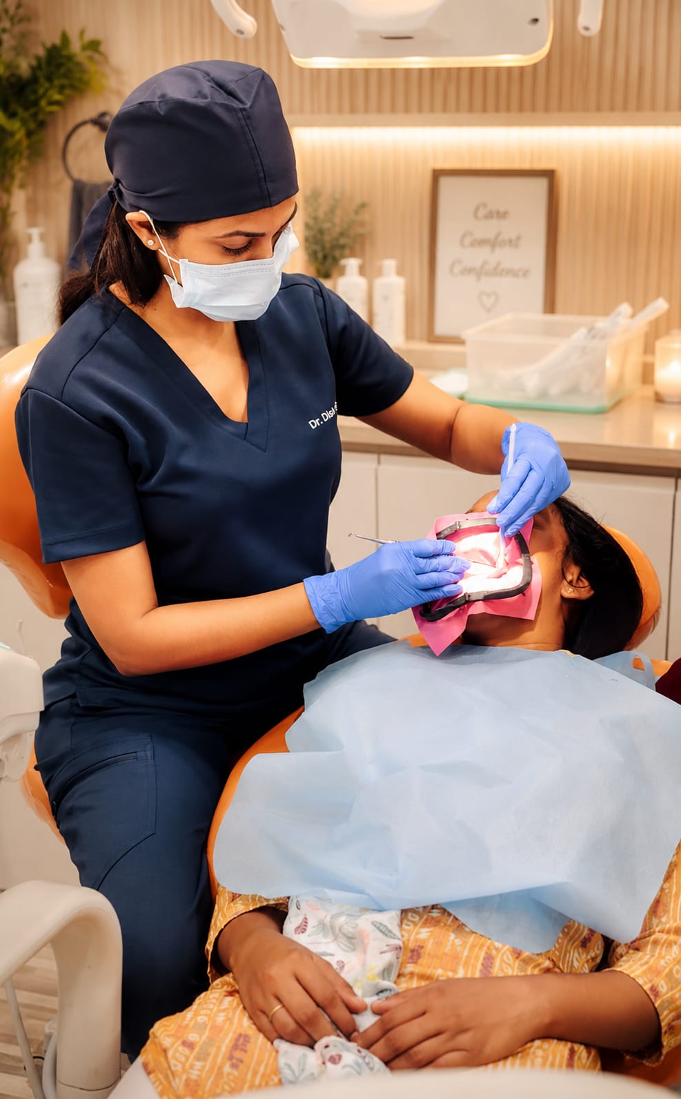 Dr. Disha Sanghvi performing a dental procedure